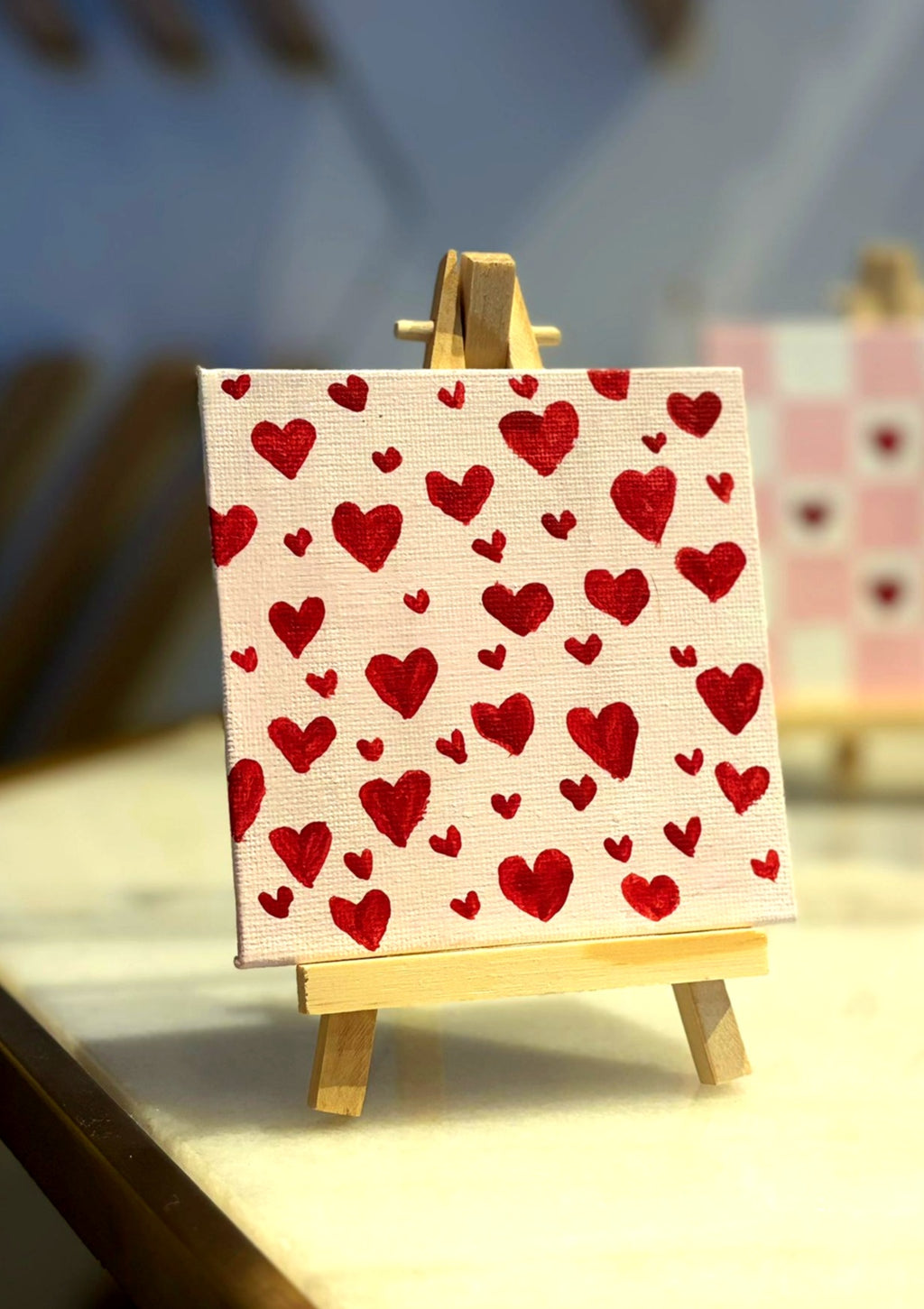 Hand-painted hearts on mini easel